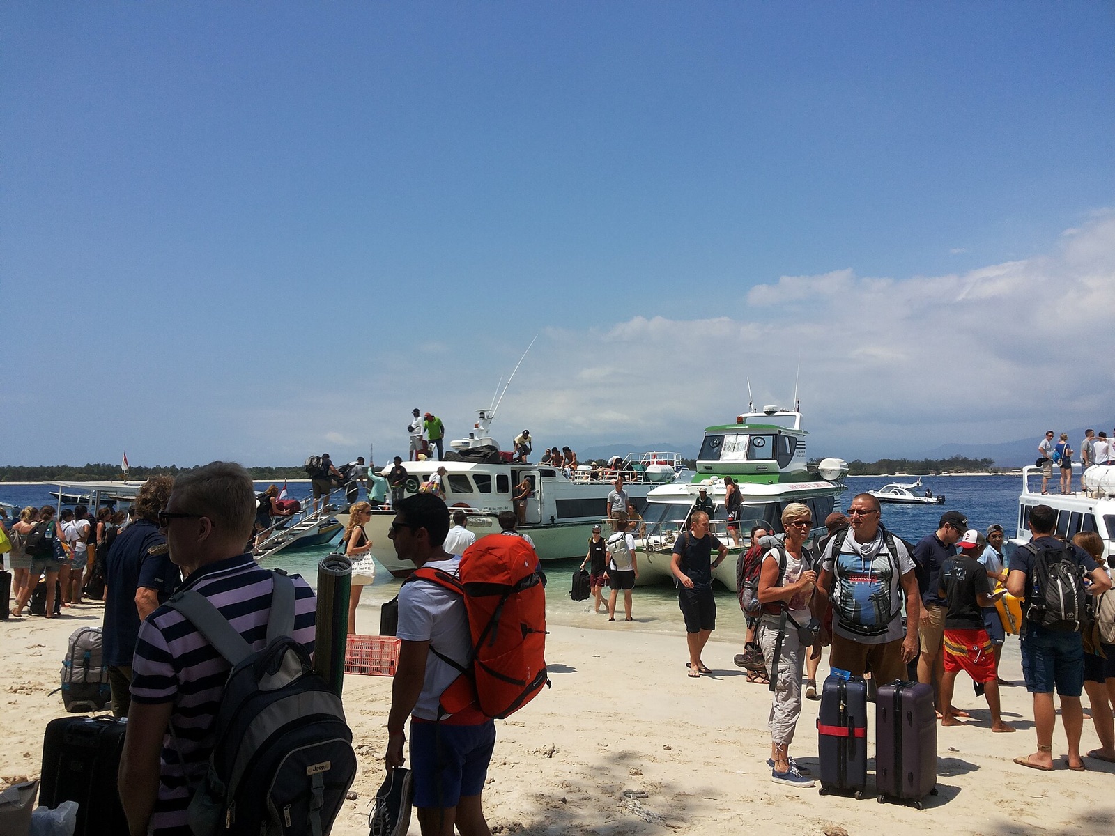 Passengers boarding a tourist fast boat